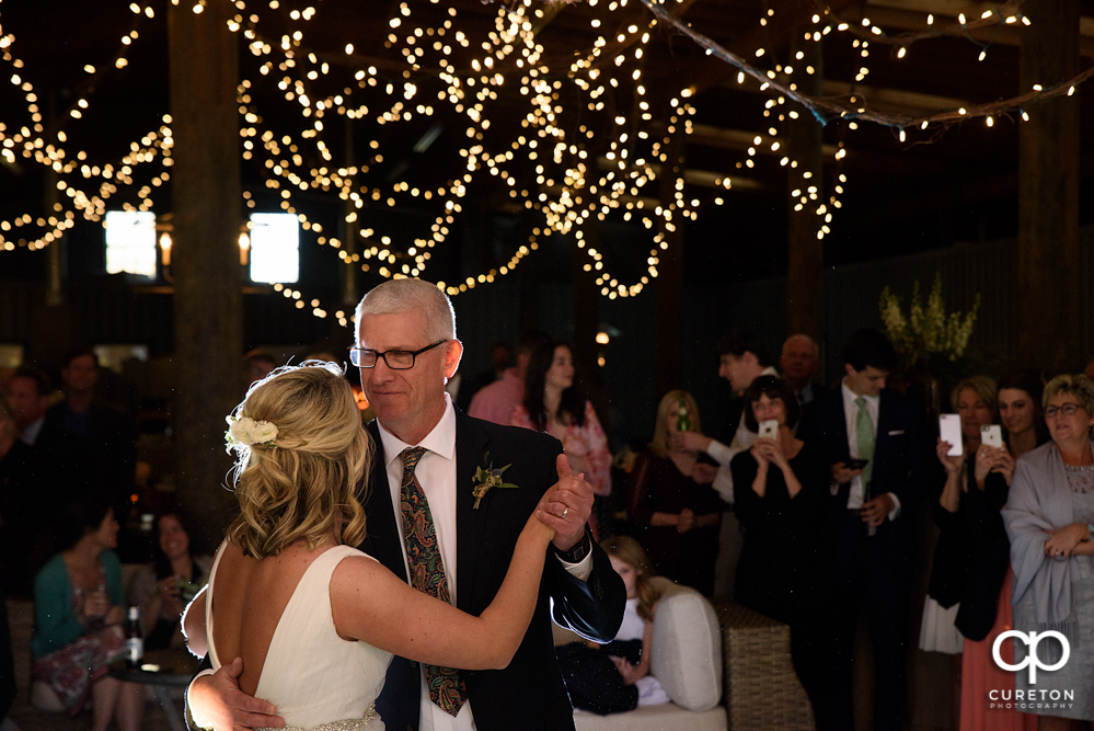 Bride and Father dance at the wedding reception.