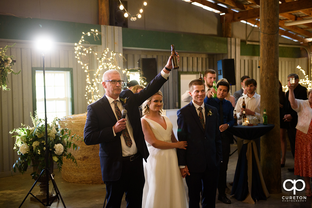 The bride's father giving a toast.