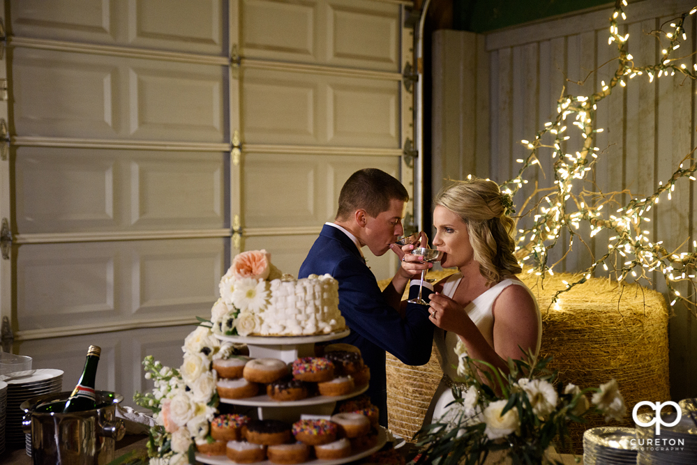 Bride and groom cutting the cake.