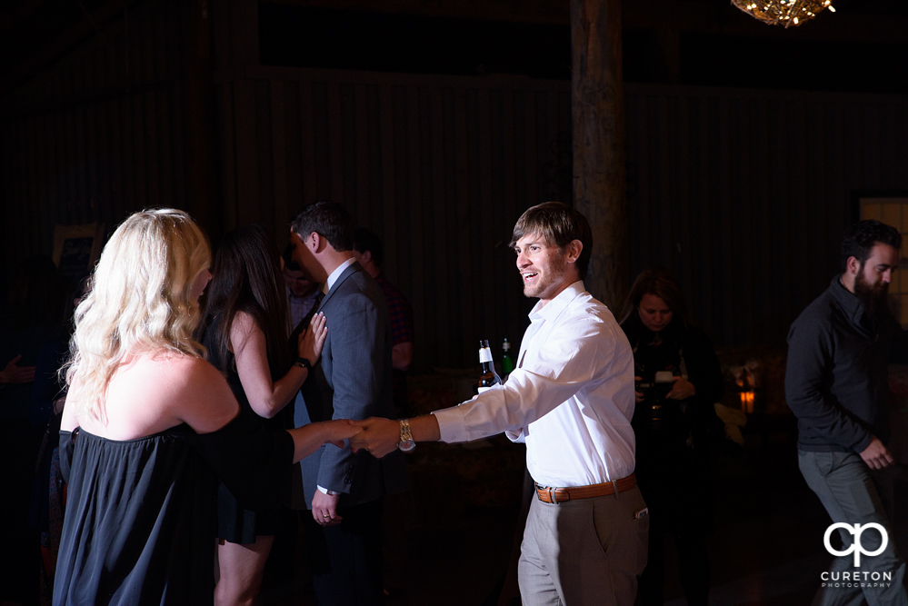 Wedding Guests dancing at the Greenbrier Farms wedding reception while Uptown Entertainment dj's.