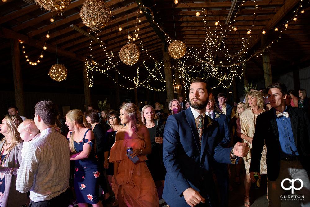 Wedding Guests dancing at the Greenbrier Farms wedding reception while Uptown Entertainment dj's.