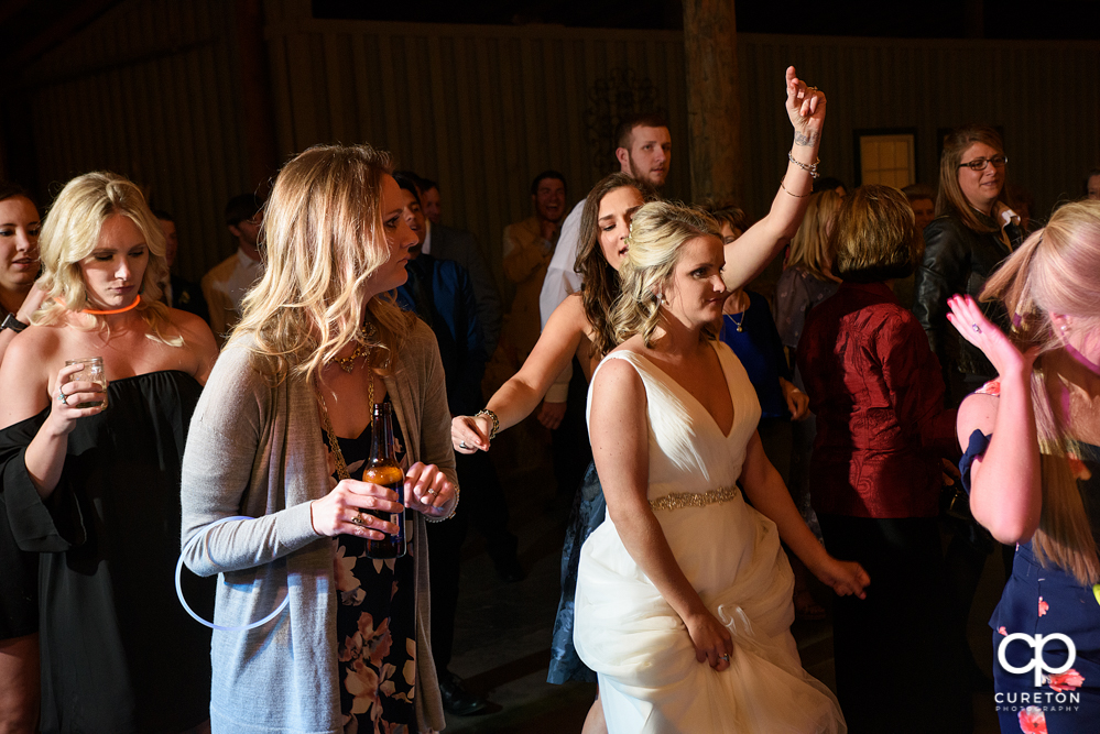 Wedding Guests dancing at the Greenbrier Farms wedding reception while Uptown Entertainment dj's.