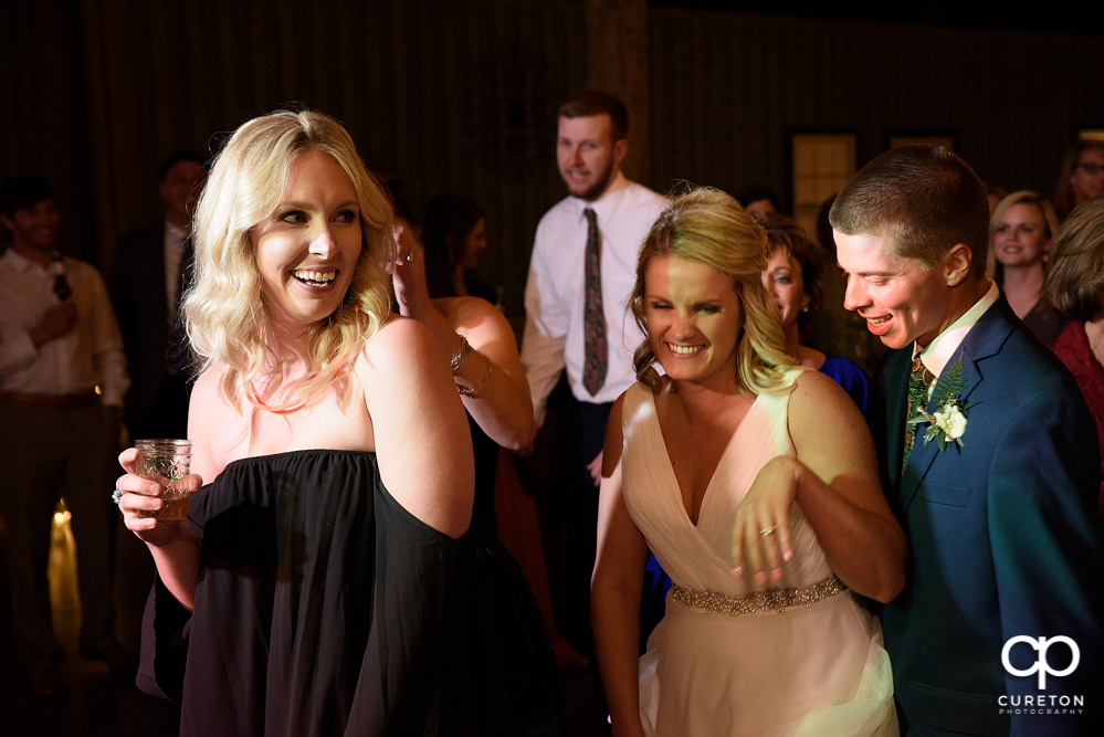 Wedding Guests dancing at the Greenbrier Farms wedding reception while Uptown Entertainment dj's.