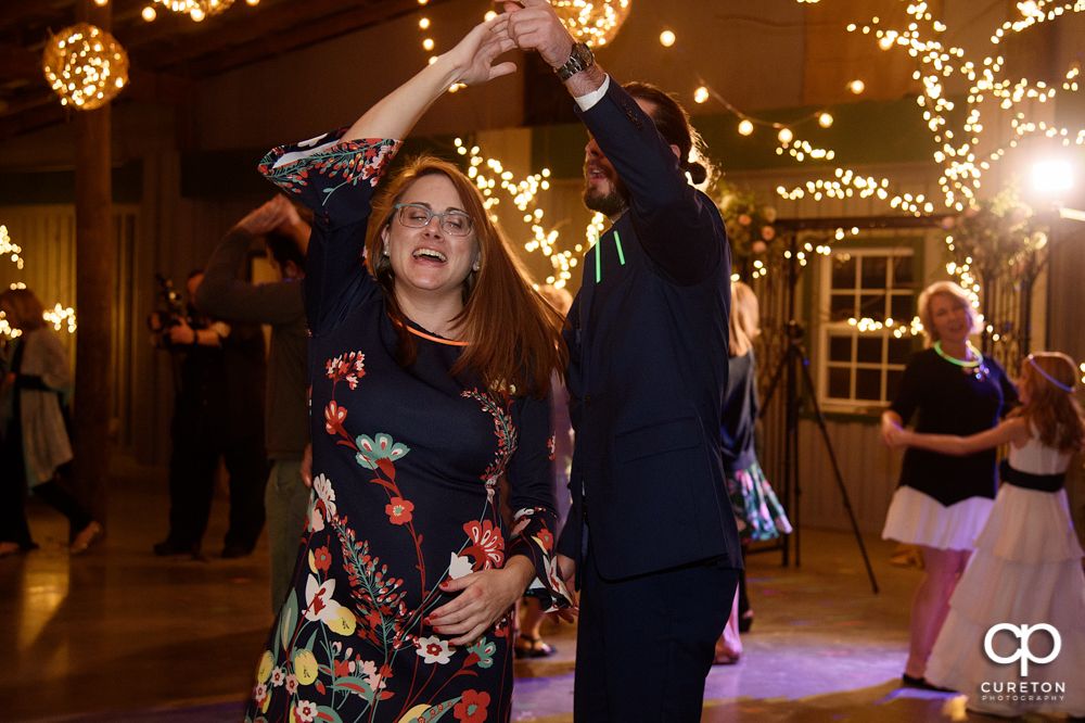 Wedding Guests dancing at the Greenbrier Farms wedding reception while Uptown Entertainment dj's.