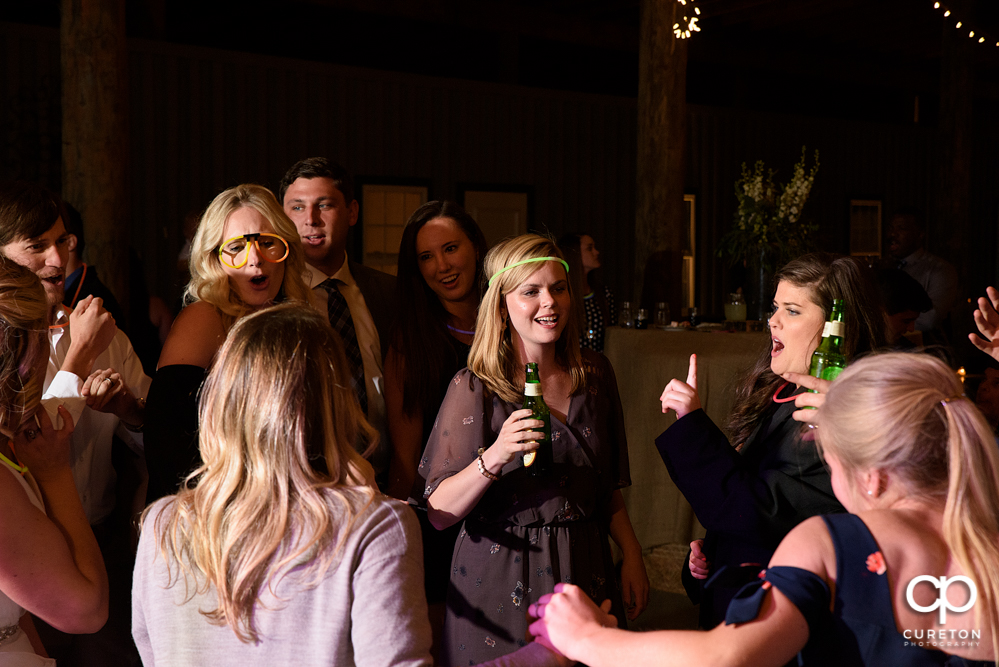 Wedding Guests dancing at the Greenbrier Farms wedding reception while Uptown Entertainment dj's.