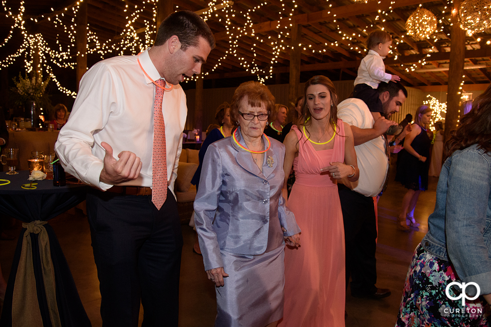 Wedding Guests dancing at the Greenbrier Farms wedding reception while Uptown Entertainment dj's.