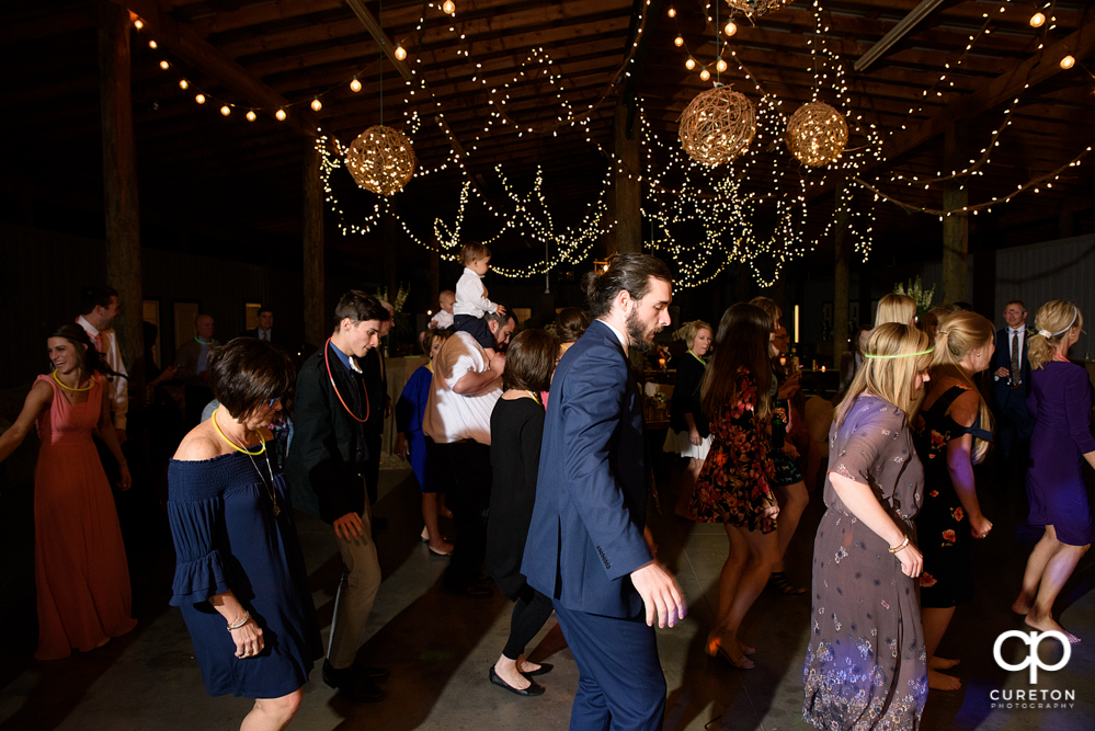 Wedding Guests dancing at the Greenbrier Farms wedding reception while Uptown Entertainment dj's.