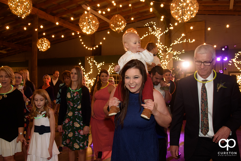 Wedding Guests dancing at the Greenbrier Farms wedding reception while Uptown Entertainment dj's.