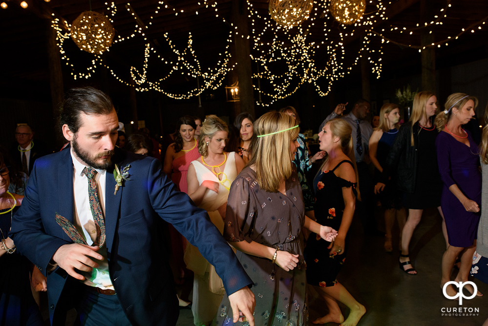 Wedding Guests dancing at the Greenbrier Farms wedding reception while Uptown Entertainment dj's.