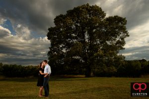 Couple kissing at the tree at Greenbrier Farms in Easley,SC.