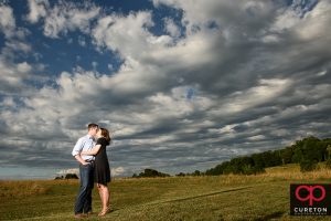 Epic engagement photo at Greenbrier Farms in teh field.