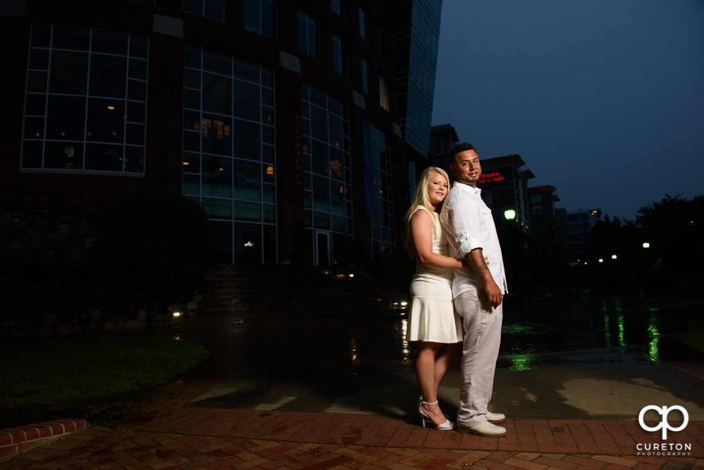 Groom and bride with the downtown city lights.
