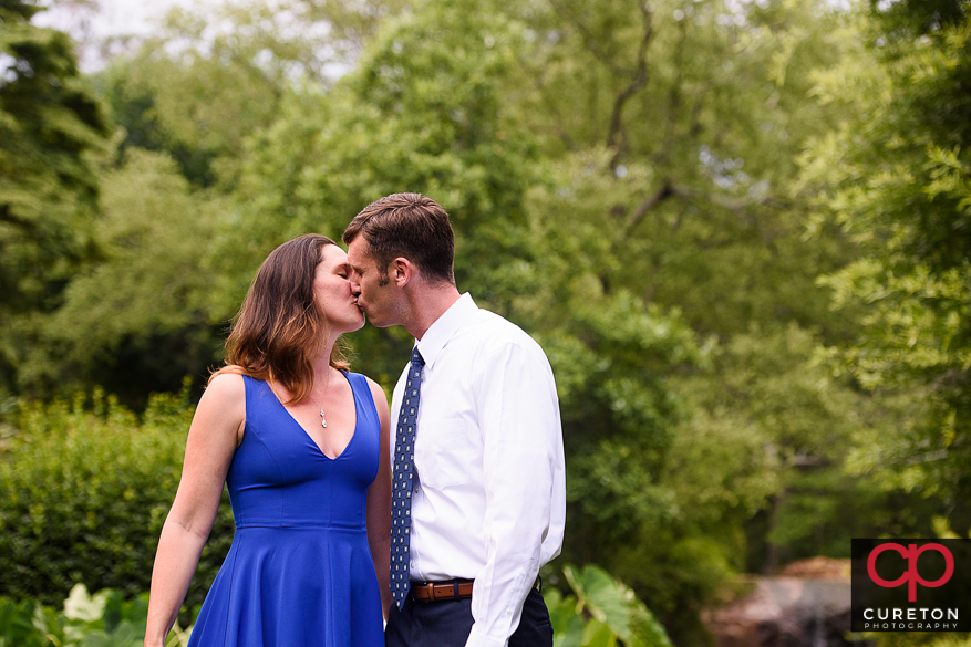 Engaged couple having fun in a downtown Greenville,SC park.