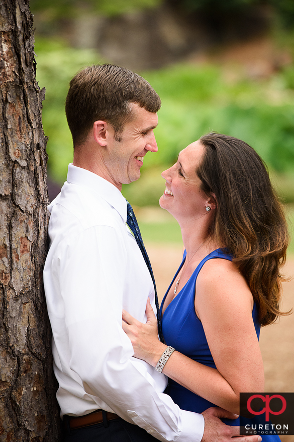 Engaged couple having fun in a downtown Greenville,SC park.