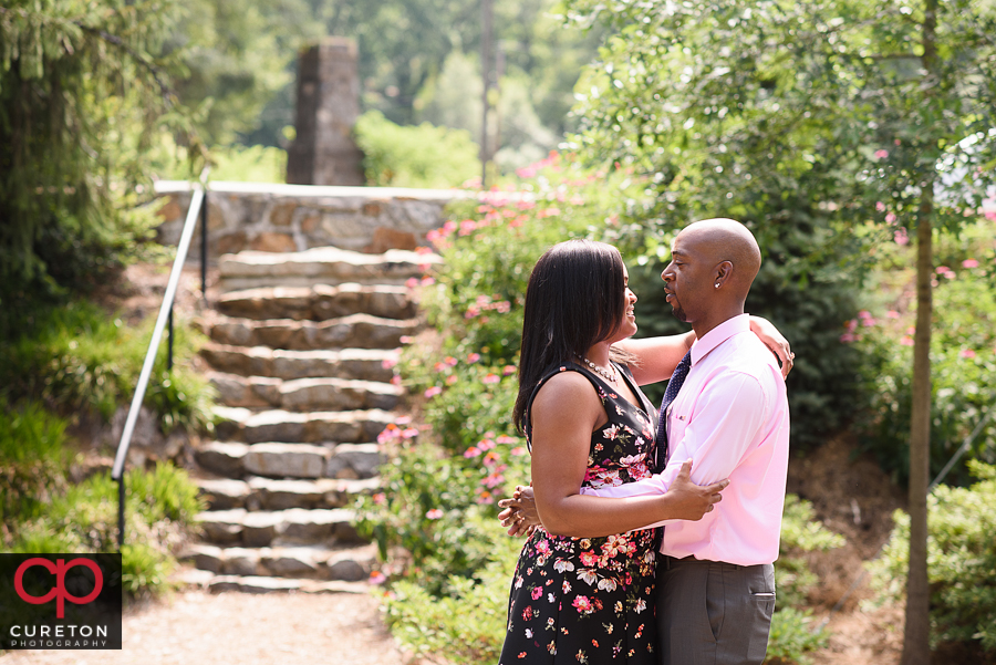 Married couple hugging in th epark.