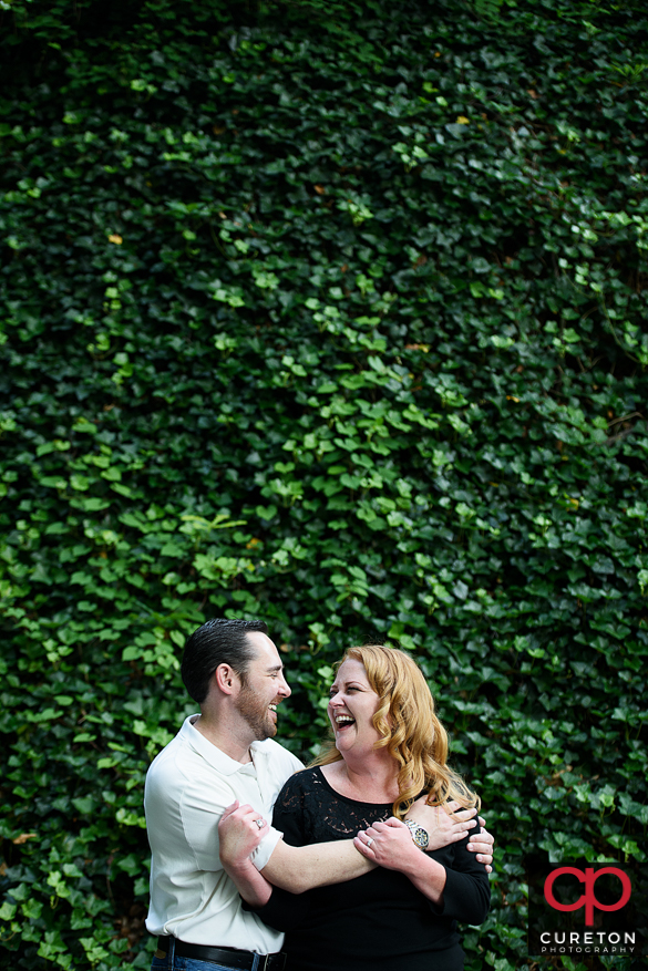 A future bride and groom at an greenville sc downtown engagement session in falls park.