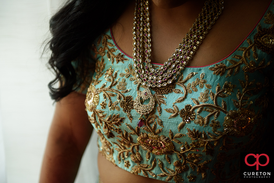 Indian bride showing her necklace.