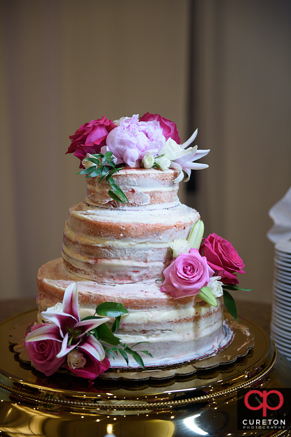 Wedding cake with with flowers.