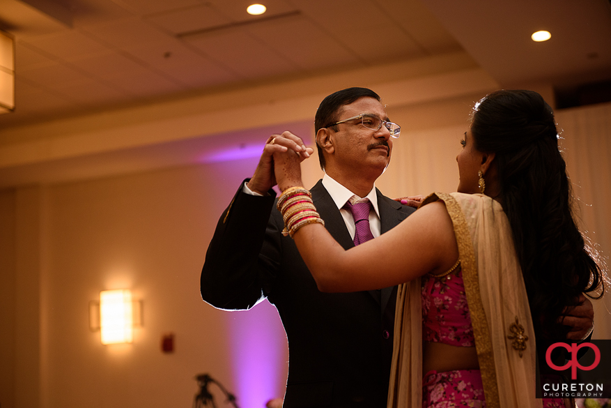 Bride and her father sharing a dance at her wedding.