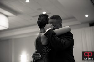 Groom and his mother sharing a dance at his wedding.