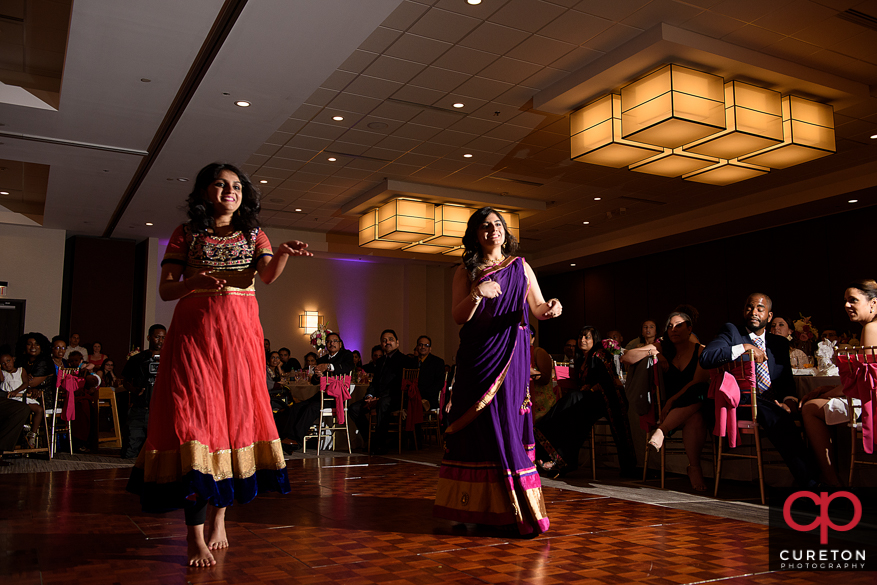 Family members performing for the bride and groom at the Indian Wedding Reception.