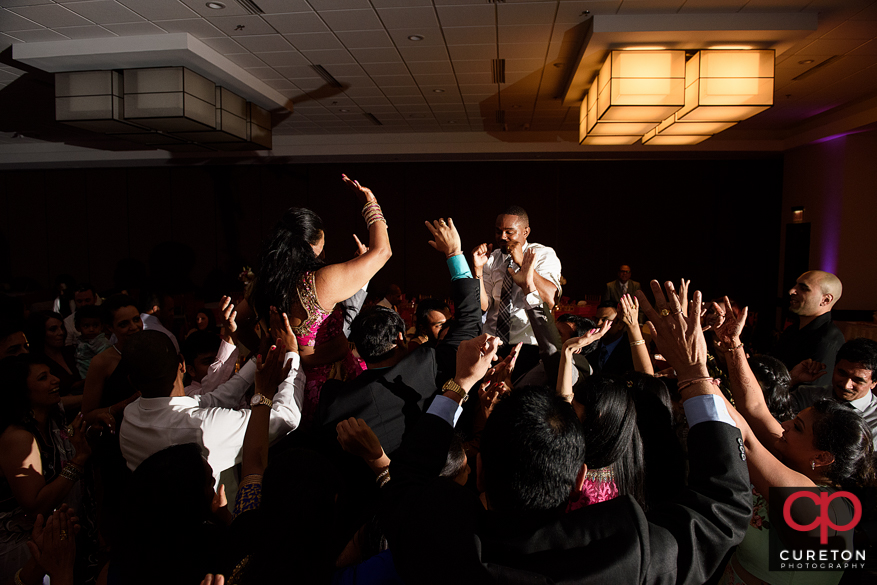 Wedding guests dancing on a packed dance floor in Greenville,Sc to the sounds of DJ Desi.