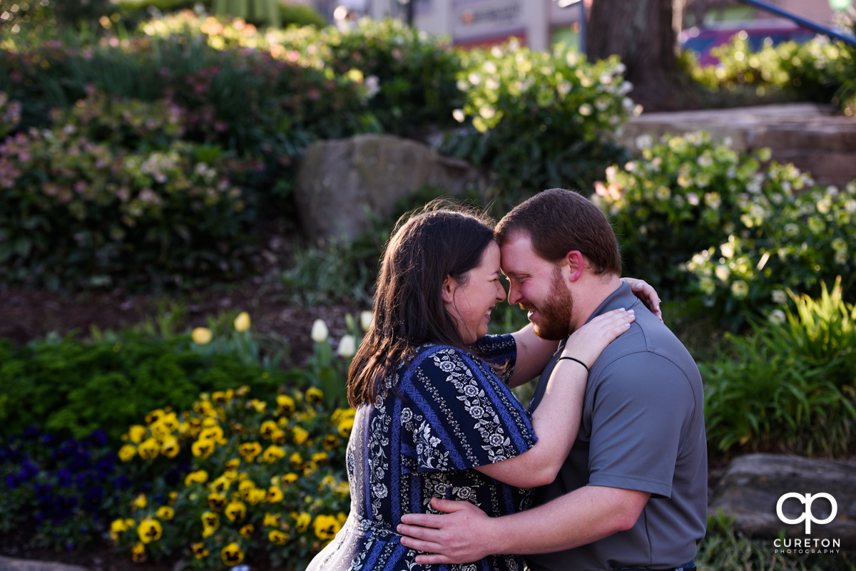 Engaged couple eskimo kissing during a Greenville,SC park engagement session.