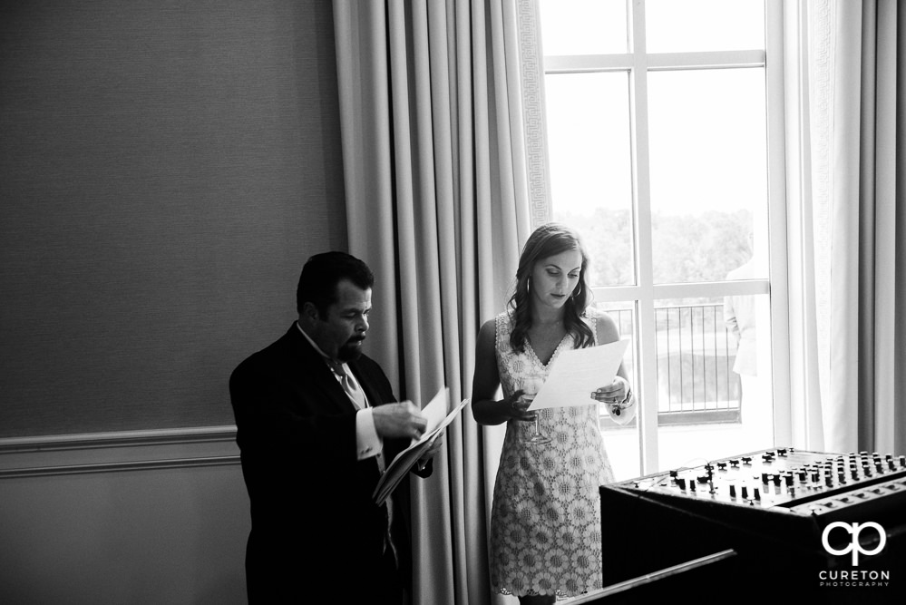 The bride and DJ at the wedding rehearsal dinner.