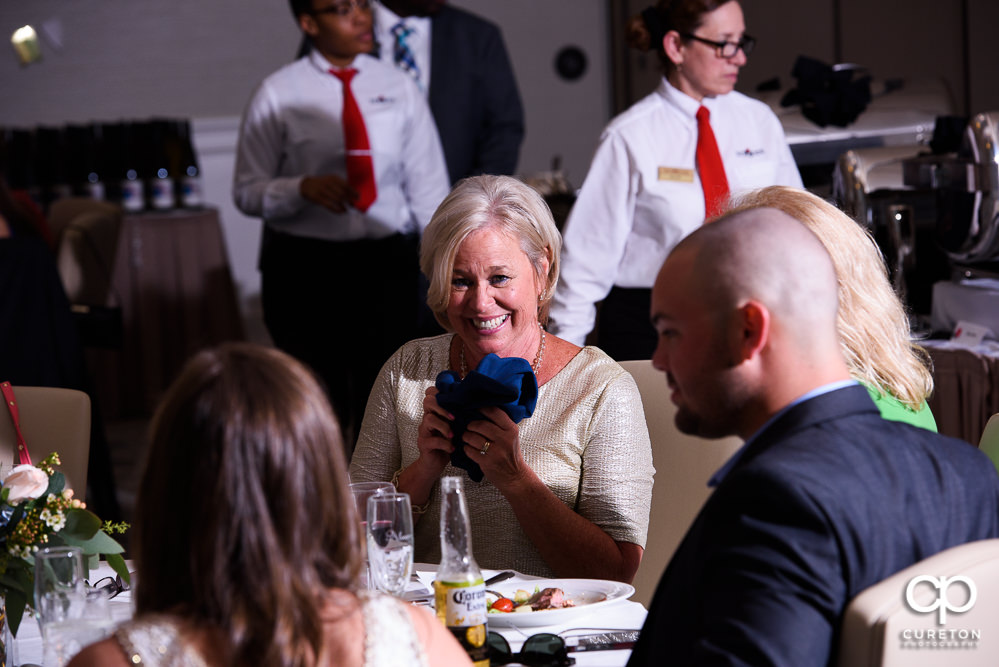 Mother of the bride laughing.