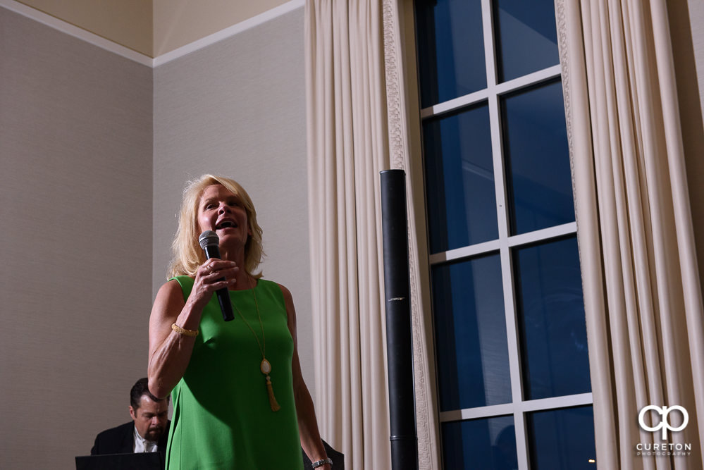 The family of the bride and groom giving speeches at the wedding rehearsal dinner at Thornblade in Greenville SC.