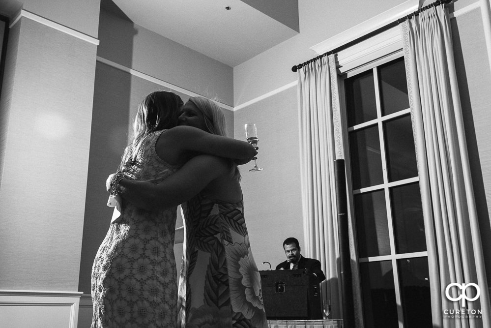 The family of the bride and groom giving speeches at the wedding rehearsal dinner at Thornblade in Greenville SC.