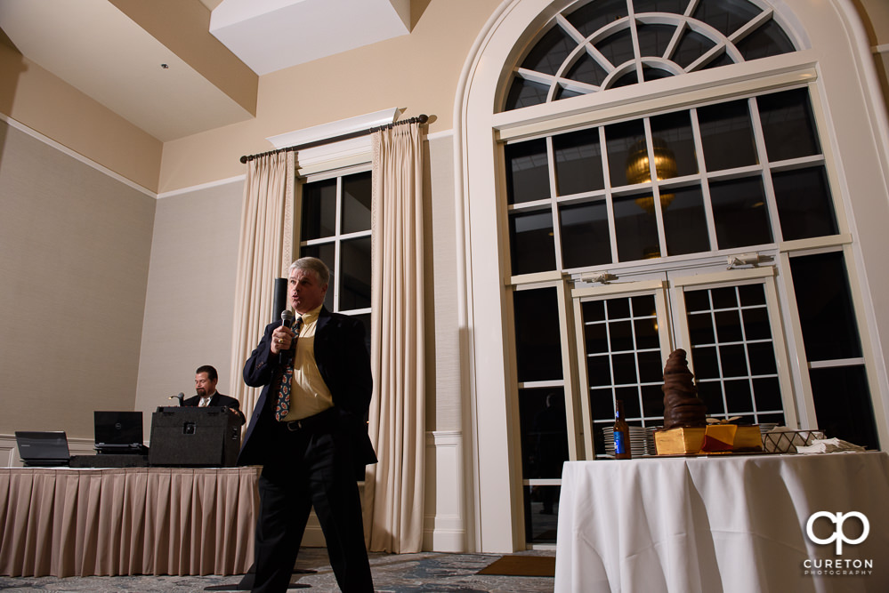 The family of the bride and groom giving speeches at the wedding rehearsal dinner at Thornblade in Greenville SC.