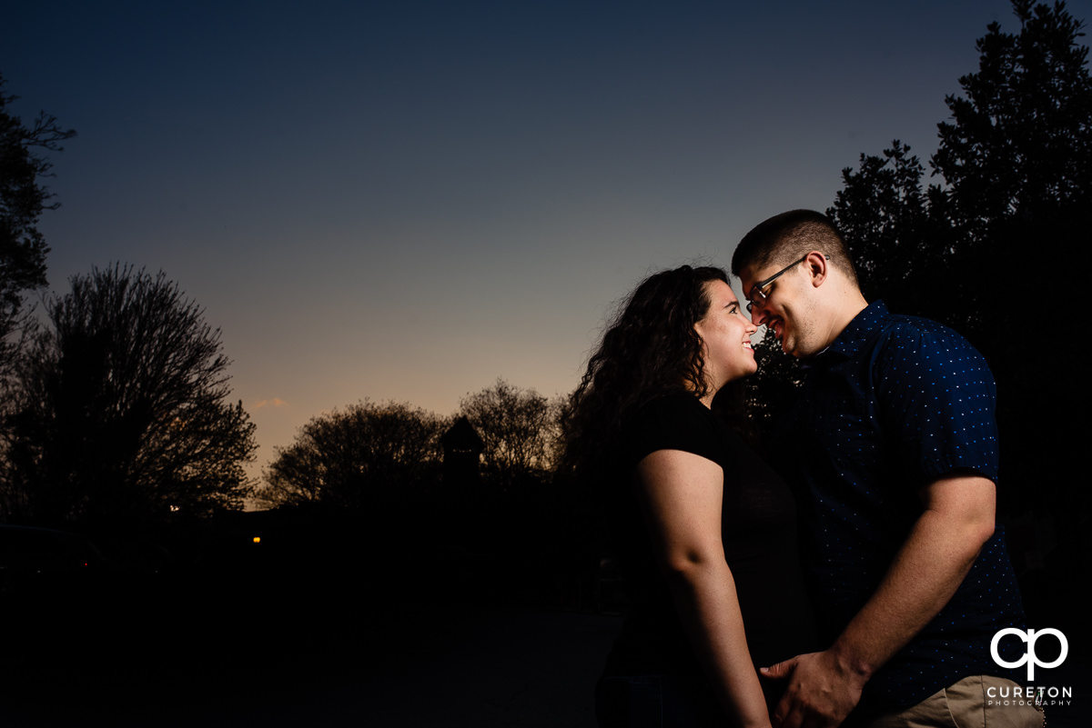 Engaged couple at sunset spring engagement session in downtown Greenville ,SC.