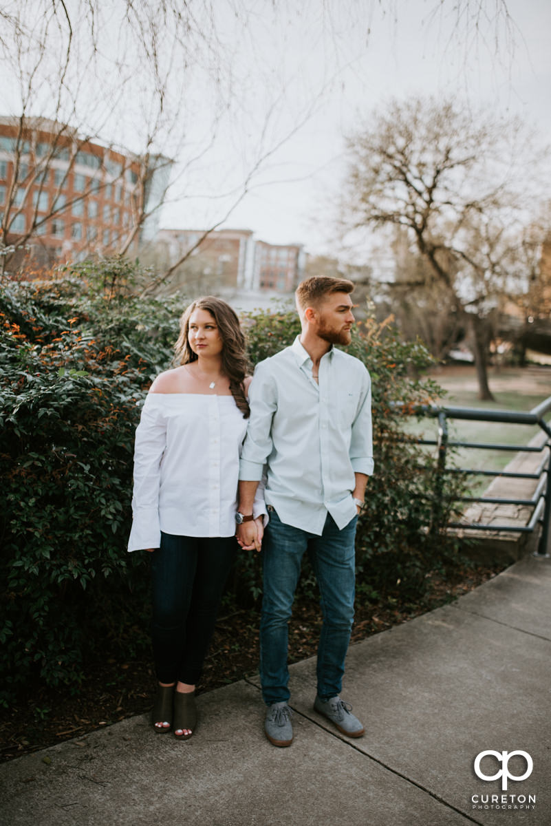 Husband and wife strolling though the park during a Greenville,SC anniversary session.