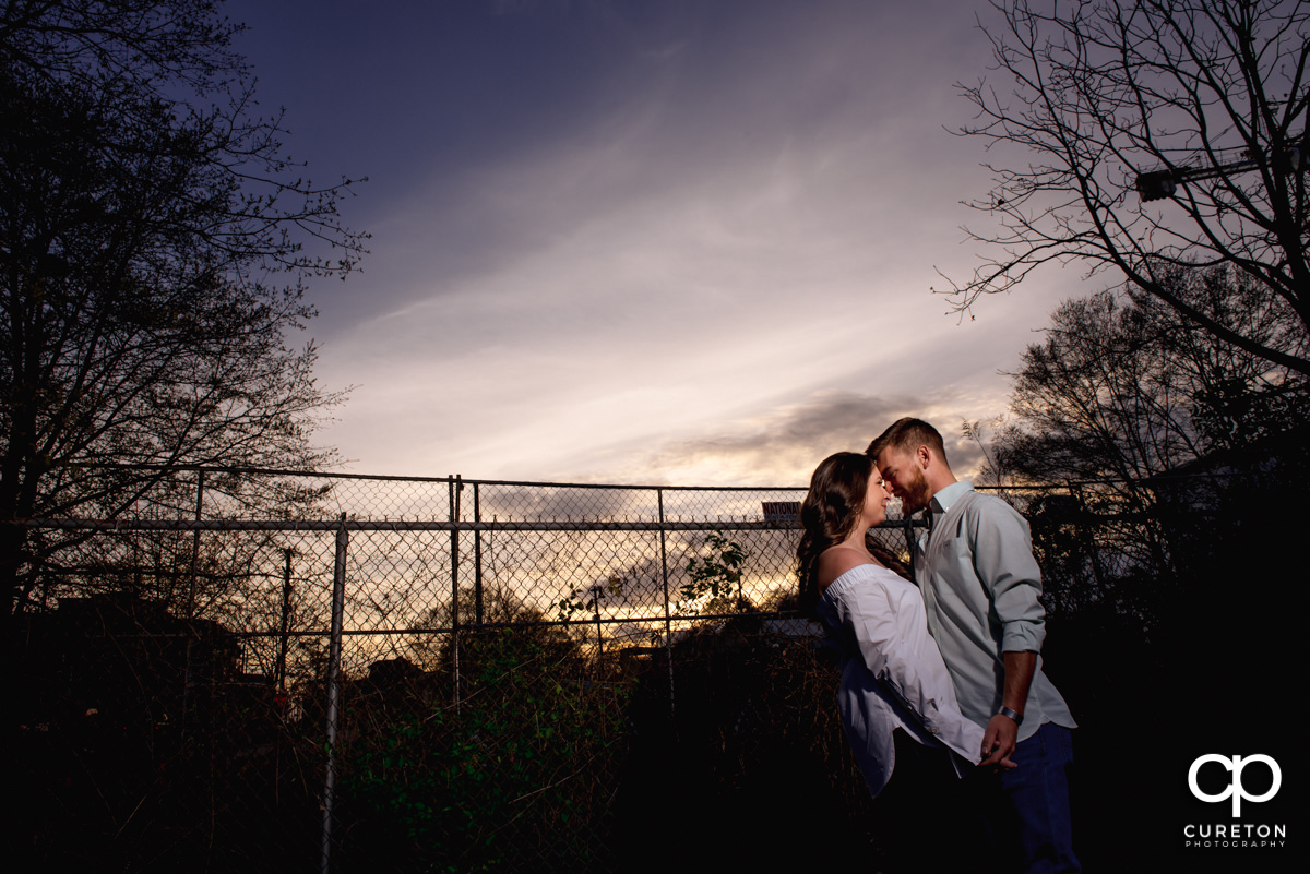 Couple dancing at sunset during a Greenville,SC anniversary session.