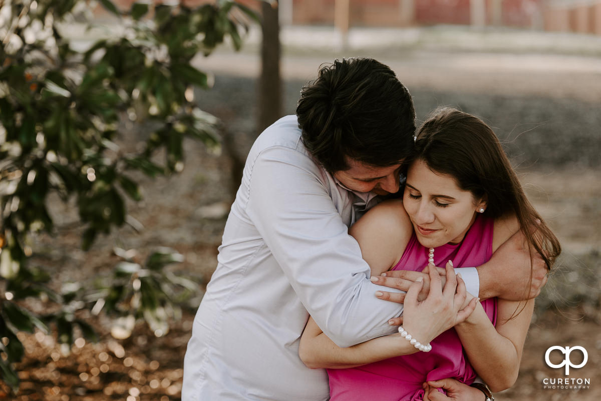 Sweet moment during an engagement session Greer City Park.