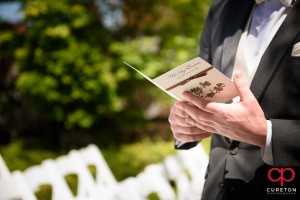 Groom reading his card before the wedding.