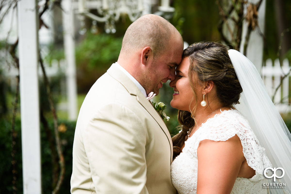 Bride and Groom smiling during their first look before the ceremony.