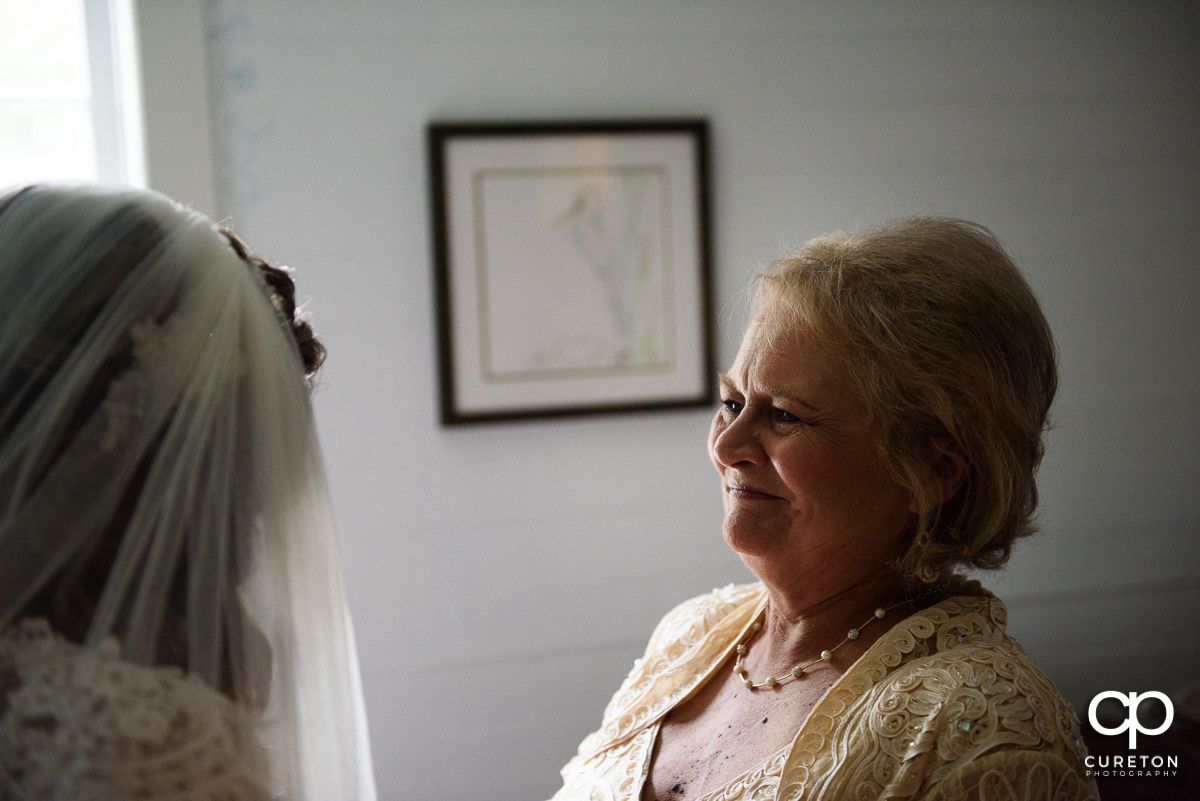 Bride's mom smiling.