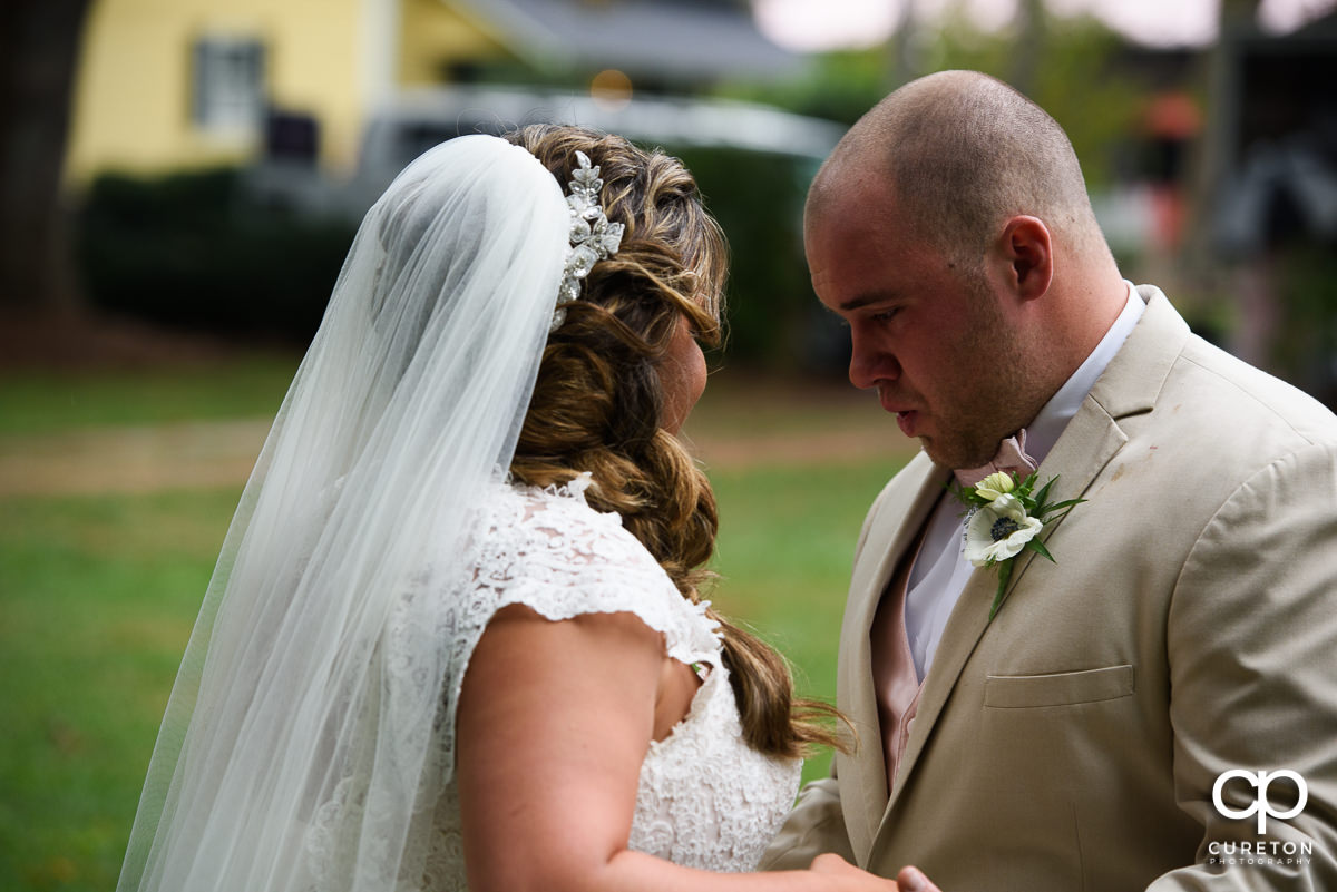 Groom getting emotional when he sees his bride at their first look.