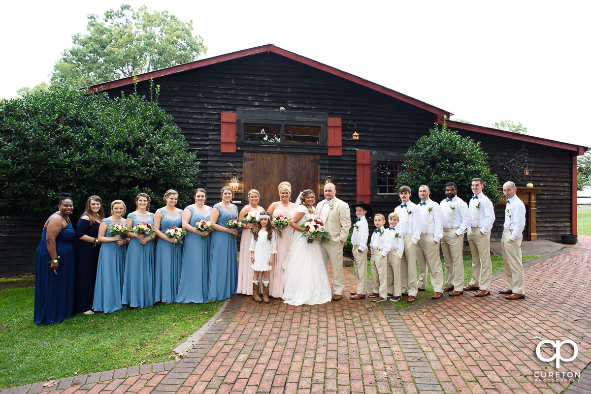 Wedding party in front of the barn at The Grove at Pennington.