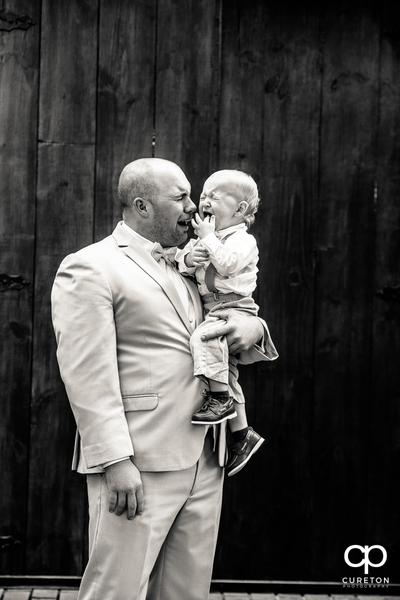 Groom and the ring bearer both crying.