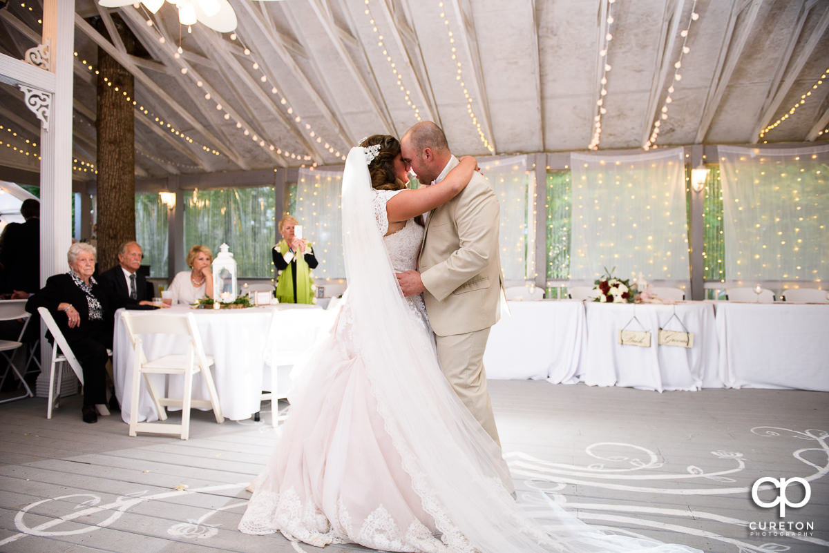 Bride and groom sharing their first dance at the wedding reception at The Grove at Pennington.