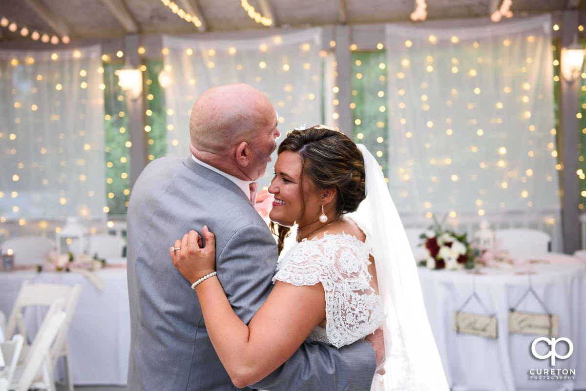 Bride dancing with her father at the wedding reception.