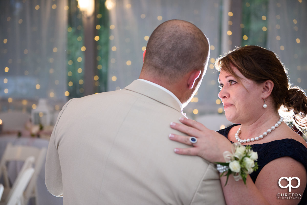 Groom dancing wth his mom.