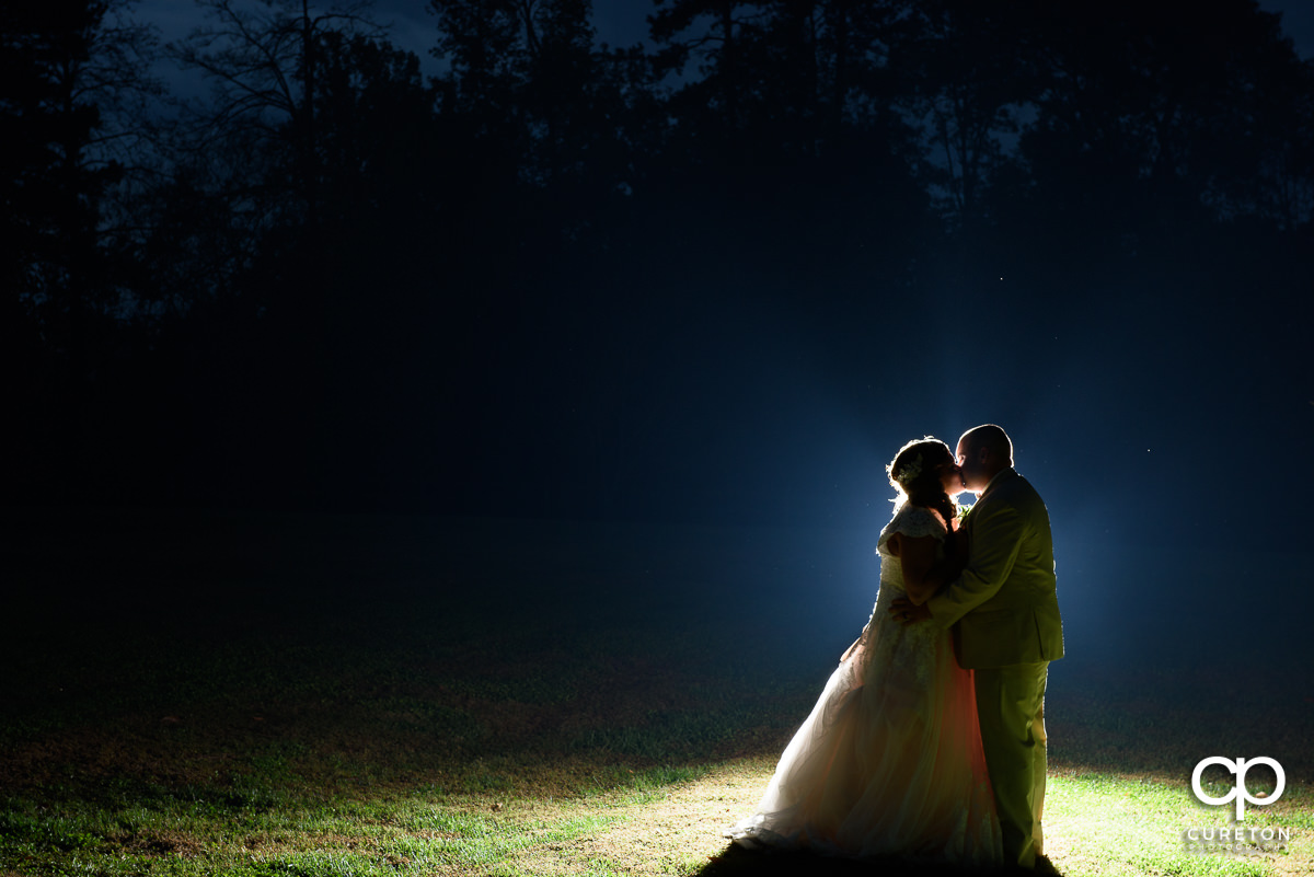 Creative backlit photo of a bride and groom at The Grove at Pennington.