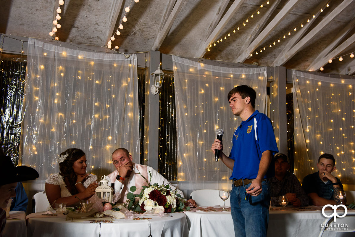 Groom's brother toasts the couple.