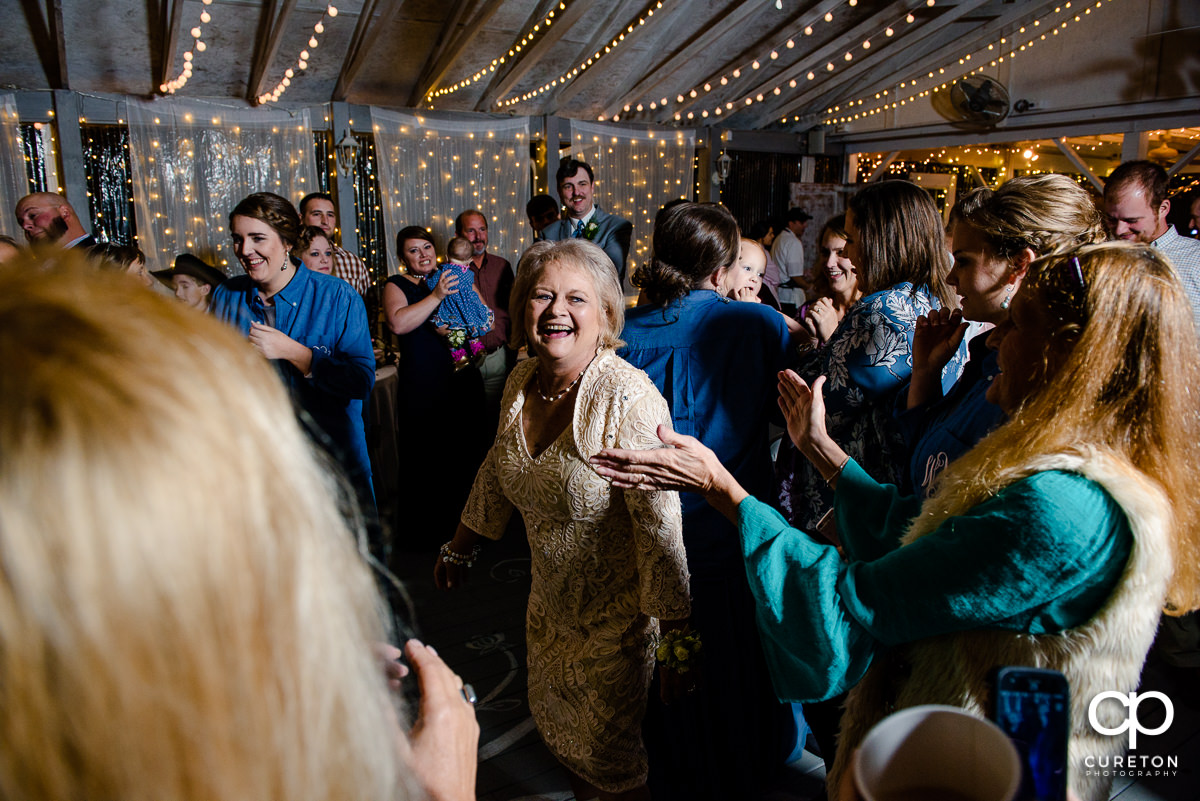 Bride's mom dancing at the reception.