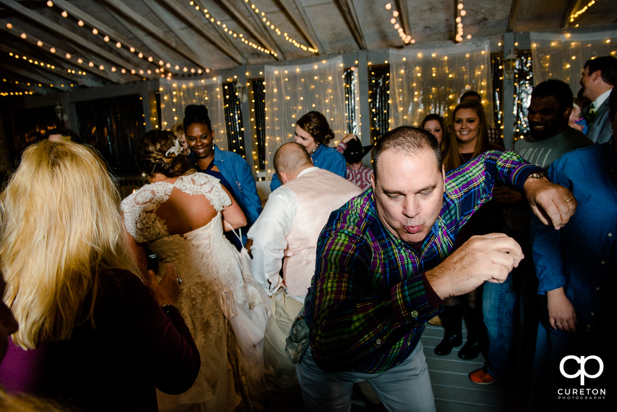 Wedding guests dancing at the reception.