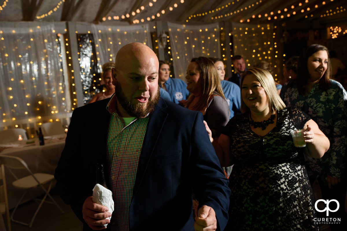 Wedding guests dancing at the reception at the Grove at Pennington.